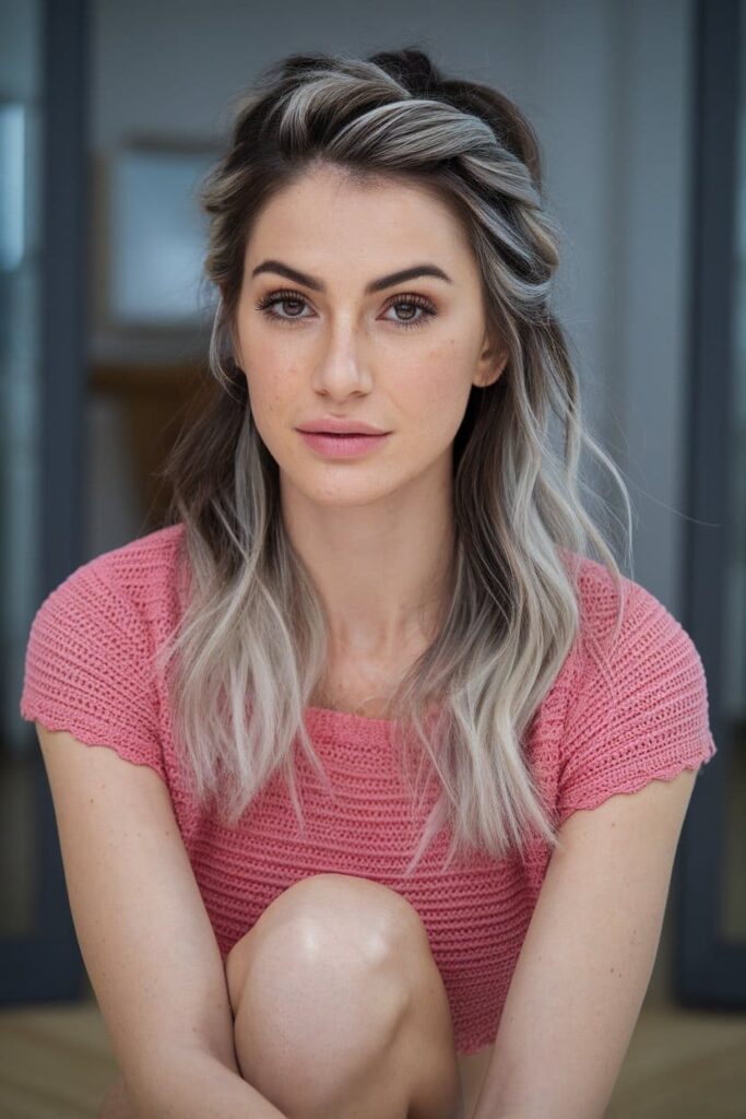 The hairstyle is Half-Up Half-Down Twist with Silver Highlights brown hair hairstyle.